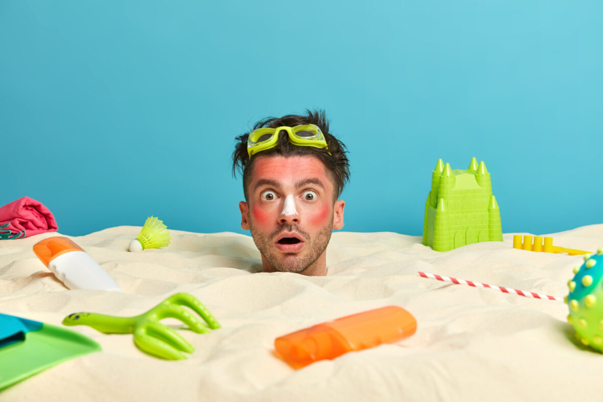 Mann steckt im Sand fest